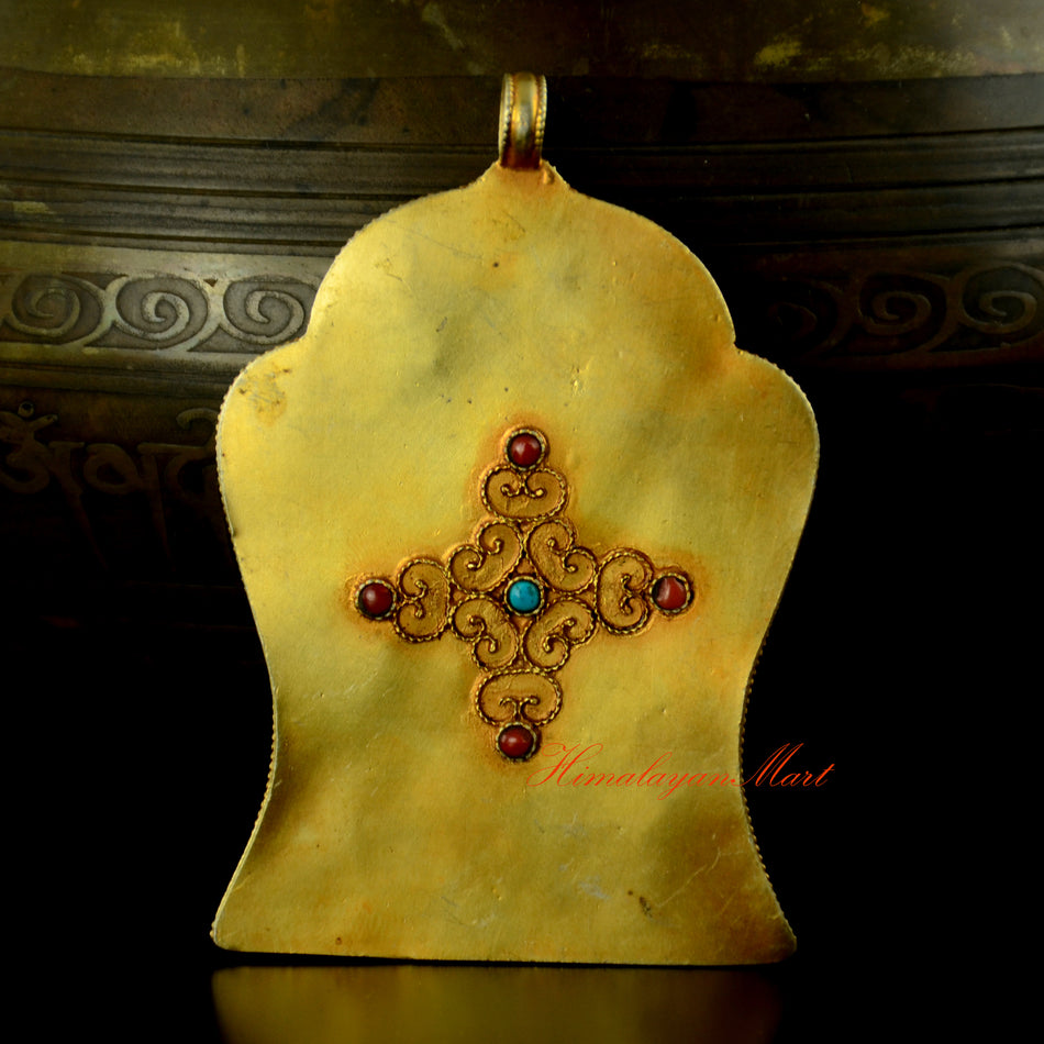 Back view of Four Armed Avalokiteshvara Pendant showing gold-plated silver craftsmanship and detailed carving