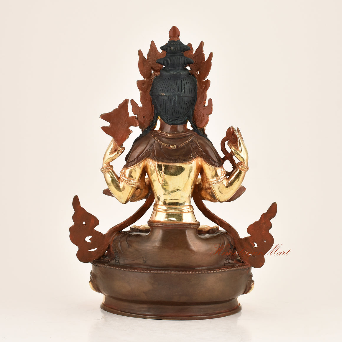 Back view of the Four-Armed Chenrezig Statue displaying the detailed lost-wax cast copper alloy construction and traditional Himalayan Buddhist metalwork from Patan, Nepal