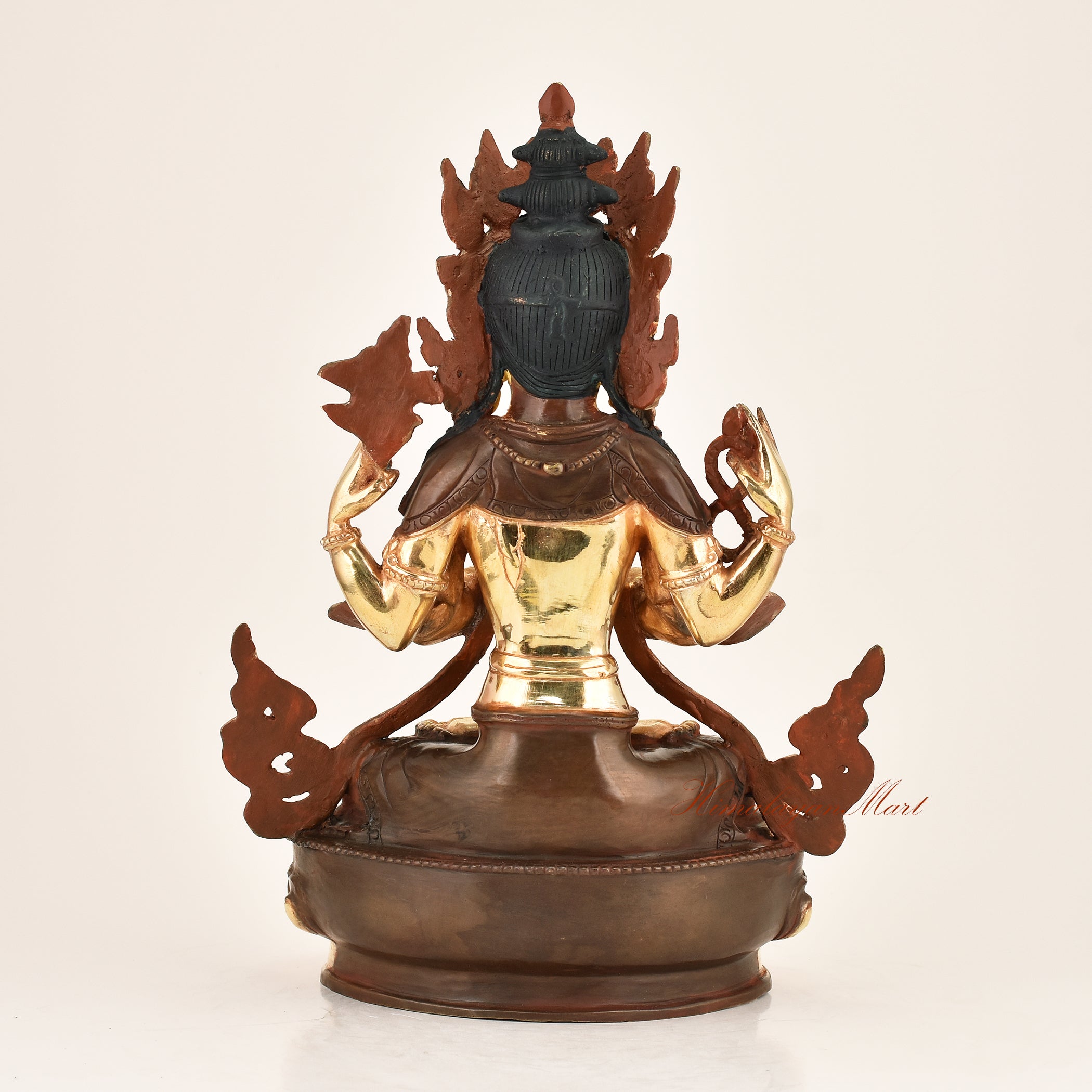 Back view of the Four-Armed Chenrezig Statue displaying the detailed lost-wax cast copper alloy construction and traditional Himalayan Buddhist metalwork from Patan, Nepal