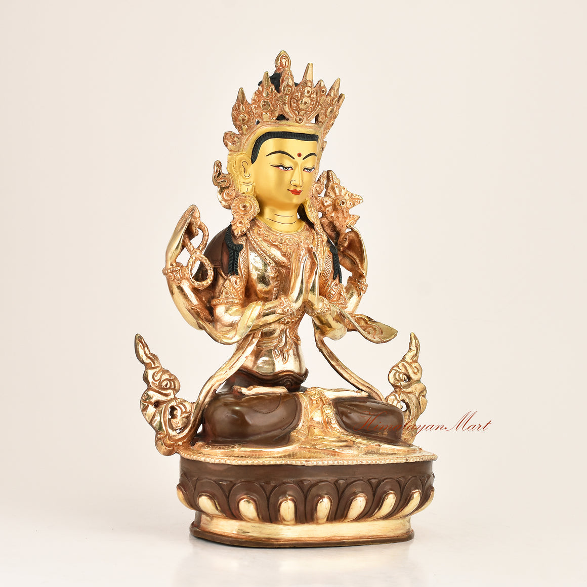 Right side view of the Four-Armed Chenrezig Statue showing fine hand-carved detailing, gold-plated finish, red polished accents, and crystal mala crafted in Patan, Nepal