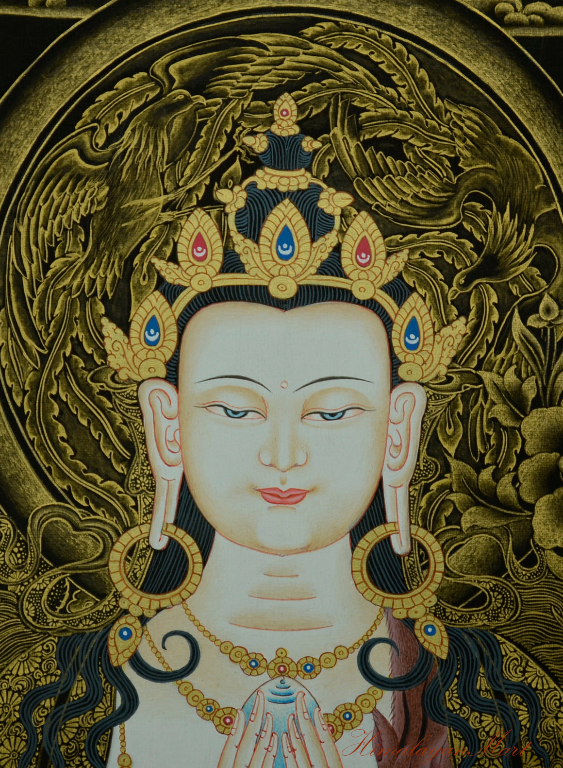 Facial detail of Four-Armed Chenrezig showing serene expression and fine gold highlights.