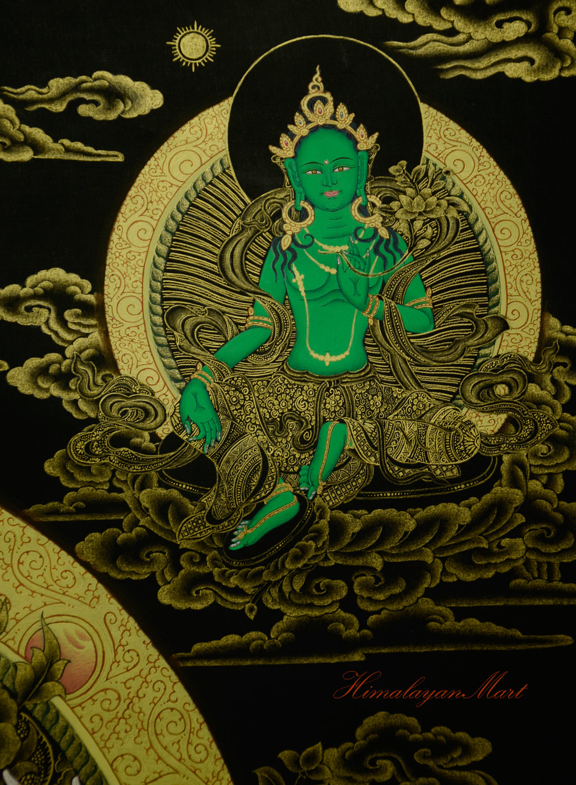 Green Tara seated on lotus base below the sun in Four-Armed Chenrezig Thangka.