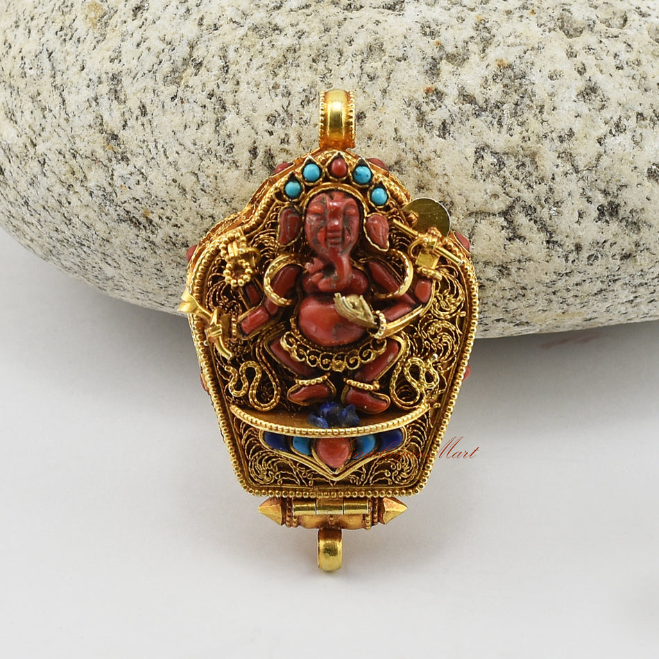 Handcrafted Ganesha Silver Ghau Pendant made of gold-plated silver with coral, turquoise, and lapis gemstones.