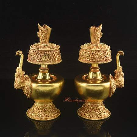Outward-facing view of Gold Plated Bhumba displaying detailed Buddhist motifs and elegant ritual form.