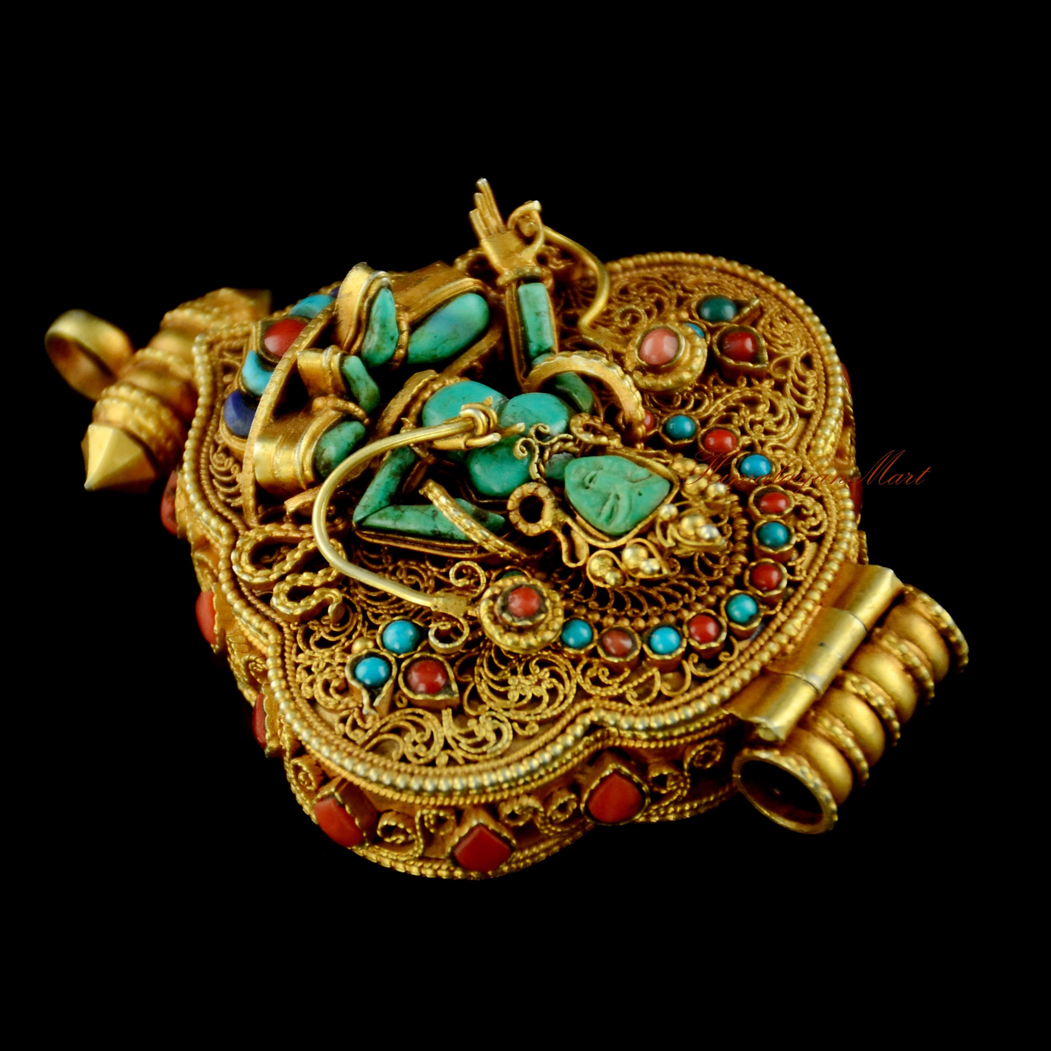 Right side view of Green Tara and White Tara Tibetan Silver Ghau with coral stone embellishments