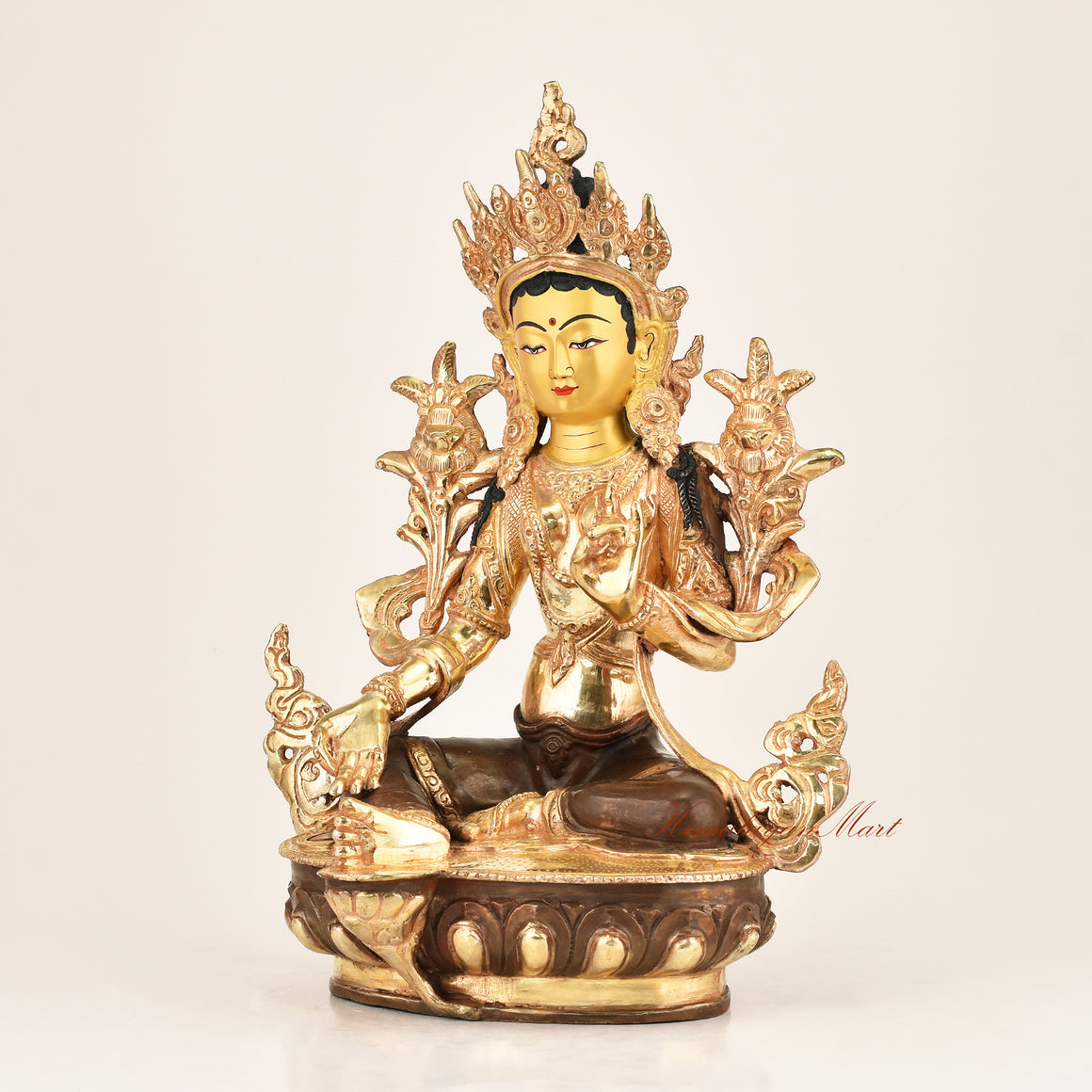 Left side view of the Green Tara Buddhist Statue revealing intricate copper alloy craftsmanship, utpala lotus detailing, and flowing garment engravings by Nepali master artisans