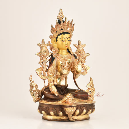 Right side view of the Green Tara Buddhist Statue showing fine hand-carved detailing, gold-plated crown ornaments, and red polished accents crafted in Patan, Nepal