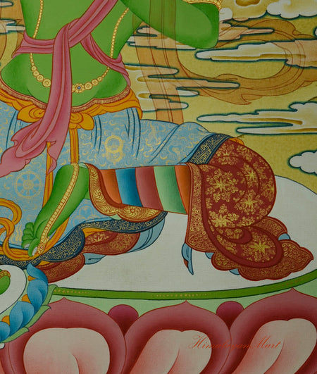 Detail of Green Tara’s left leg in relaxed meditation posture on the lotus base