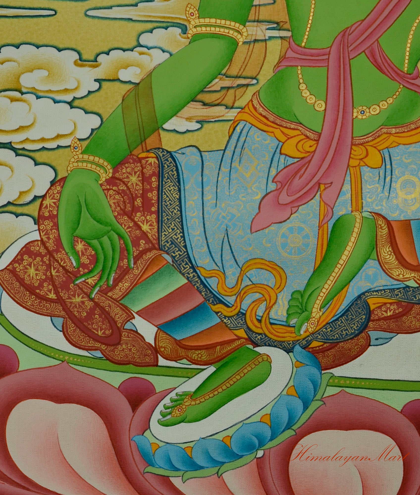 Close-up of Green Tara’s right hand in Varada Mudra with legs positioned in peaceful posture