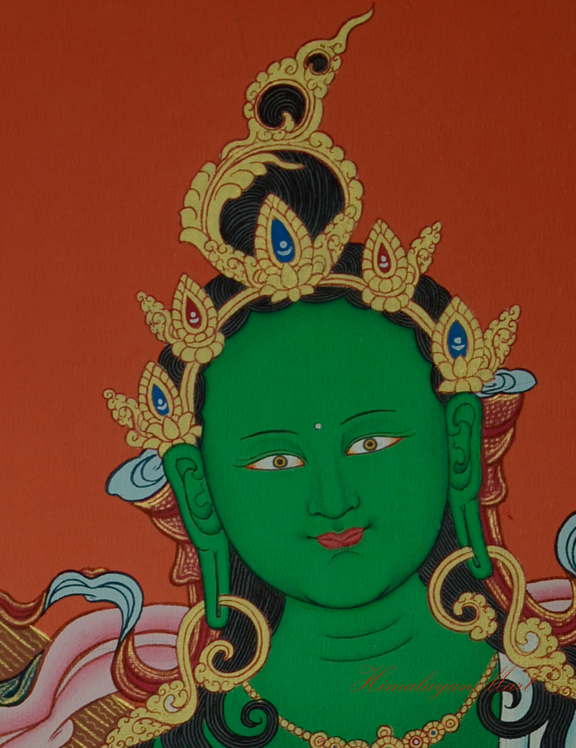 Close-up of Green Tara’s serene face, hand-painted in traditional Tibetan Thangka style.