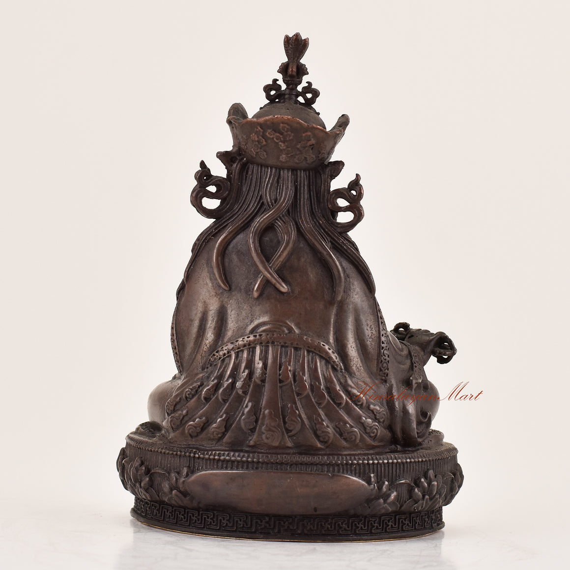 Back view of handcrafted Guru Padmasambhava statue for sale, sacred Tibetan Buddhist altar and meditation sculpture.