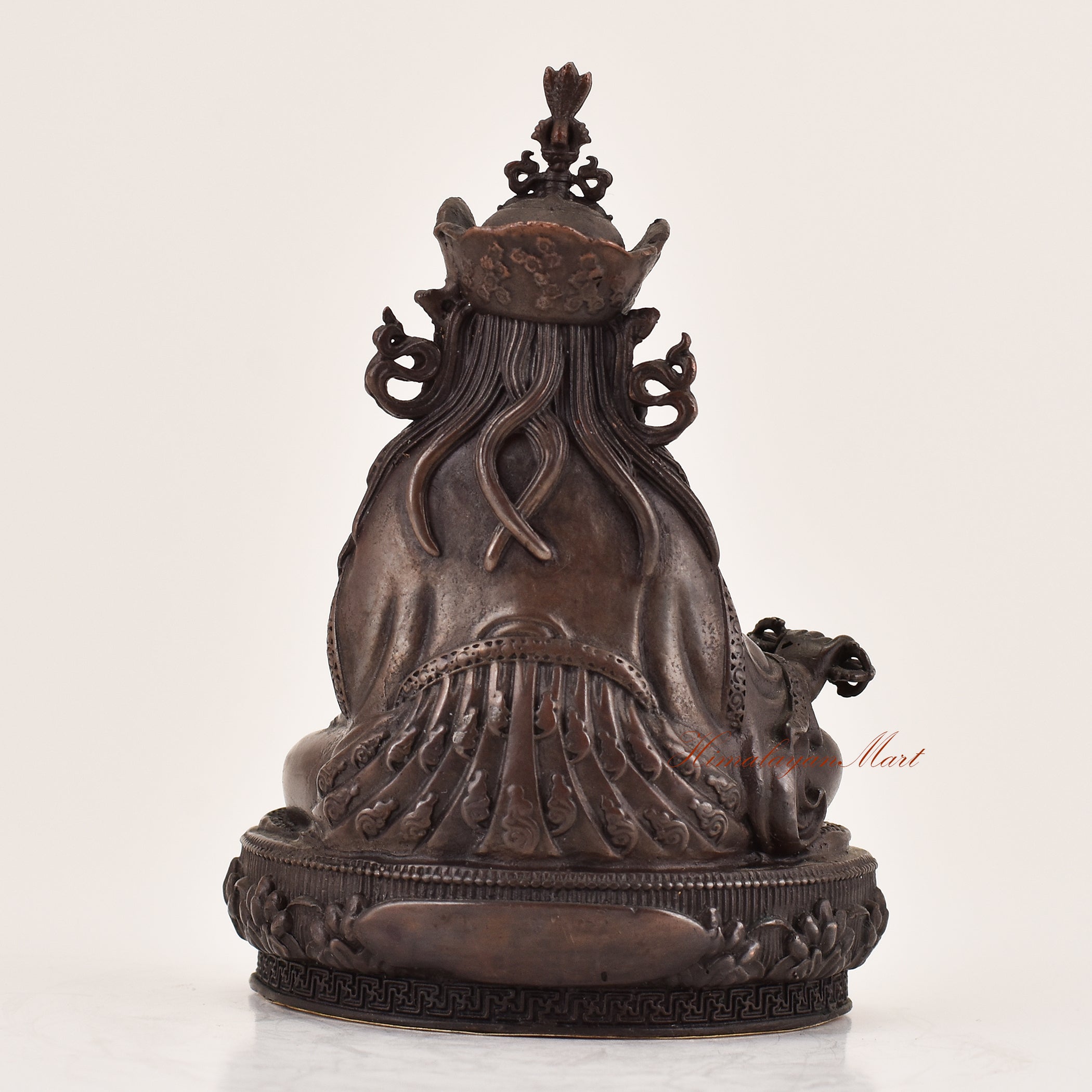 Back view of handcrafted Guru Padmasambhava statue for sale, sacred Tibetan Buddhist altar and meditation sculpture.