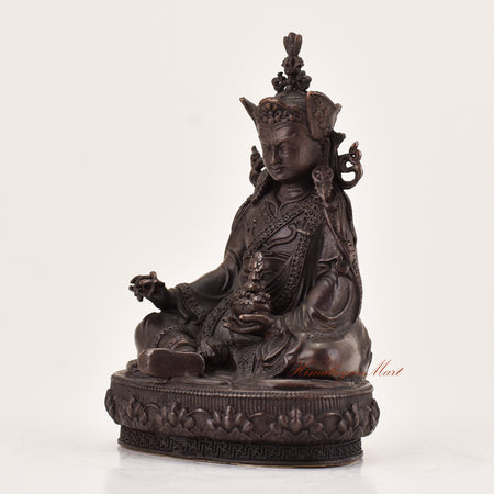 Left-side view of handcrafted Guru Padmasambhava statue for sale, Tibetan Buddhist altar and meditation sculpture.