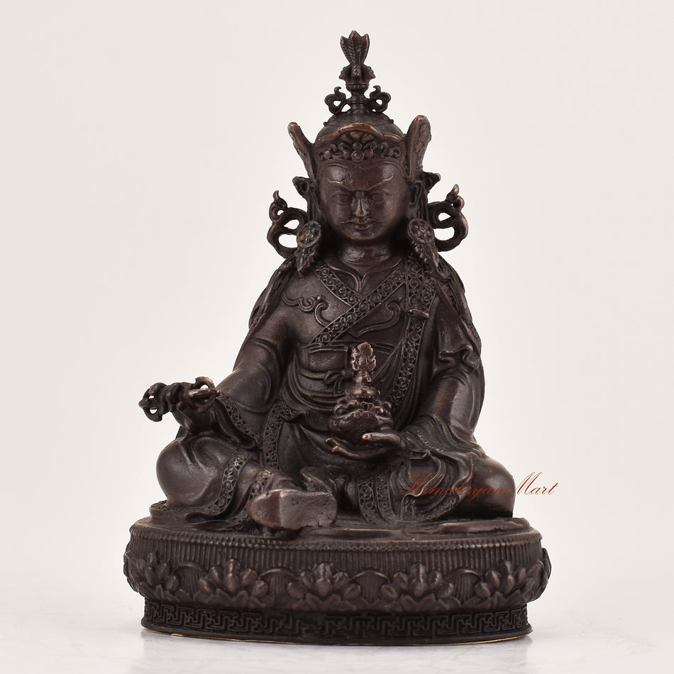 Handcrafted Guru Padmasambhava statue for sale, sacred Tibetan Buddhist master sculpture shown from the front.