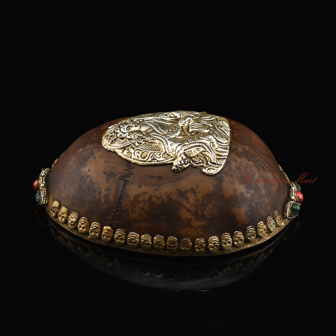 Left side view of the Guru Rinpoche-Embedded Resin Kapala highlighting the silver-plated copper metalwork
