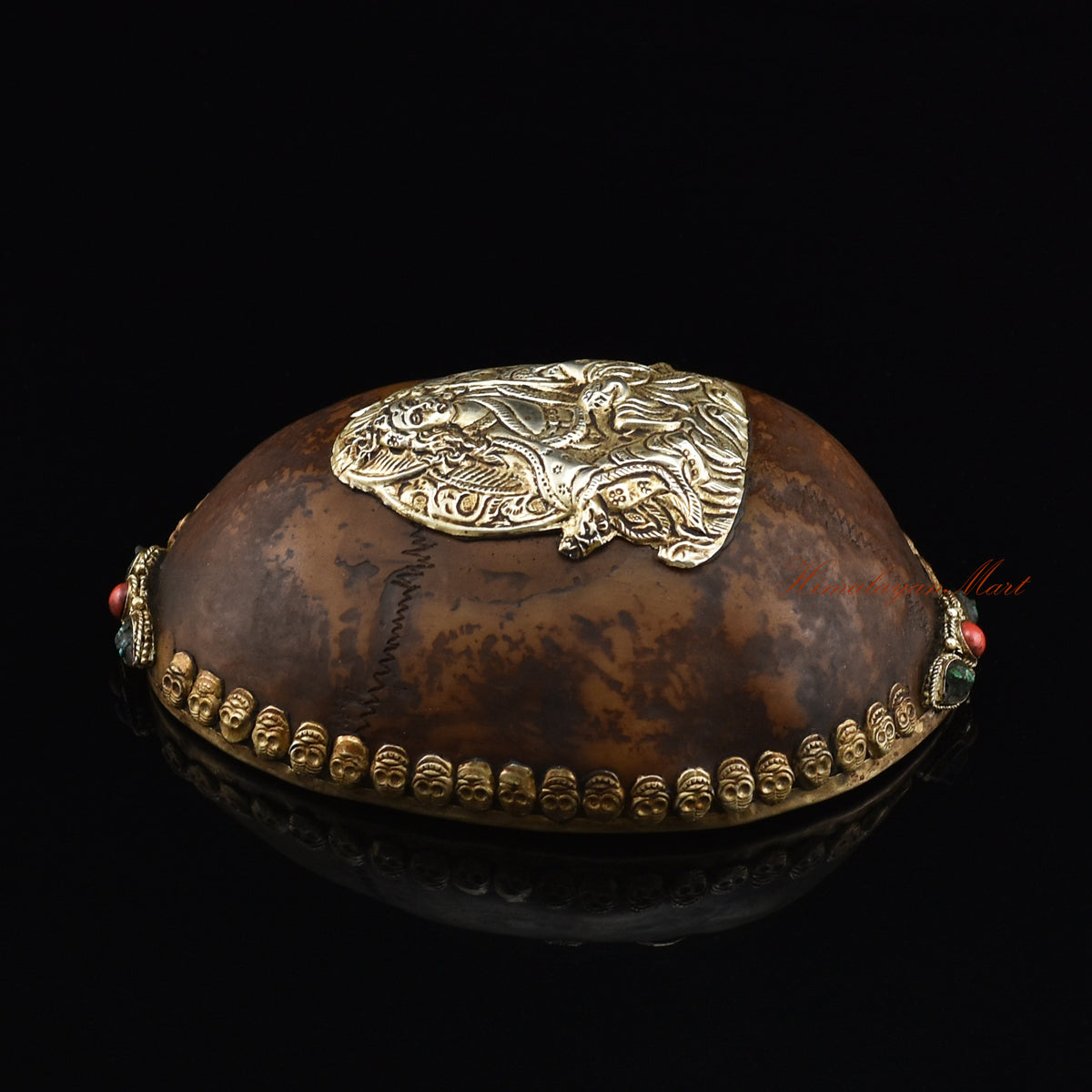 Left side view of the Guru Rinpoche-Embedded Resin Kapala highlighting the silver-plated copper metalwork