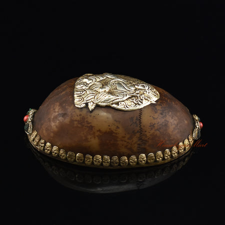 Right side view of the Guru Rinpoche-Embedded Resin Kapala showing the intricate skull border and colorful stone detailing