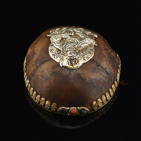 Top view of the Guru Rinpoche-Embedded Resin Kapala displaying the embedded Padmasambhava figure and skull-border design