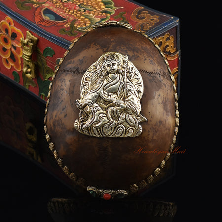 Guru Rinpoche-Embedded Resin Kapala with an ornate skull border and silver-plated copper accents, front view