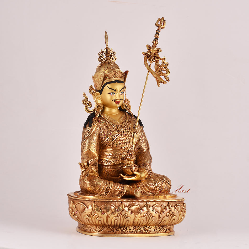 Right-side view of the Guru Rinpoche (Padmasambhava) Statue showing detailed robes, ornaments, and sacred iconography.
