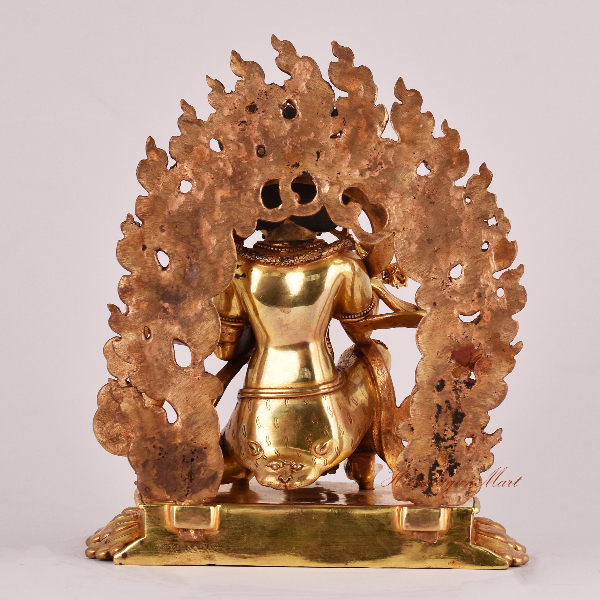 Back view of the Half-Kneeling Vajrapani Statue showing detailed textures, ornate elements, and dynamic posture.