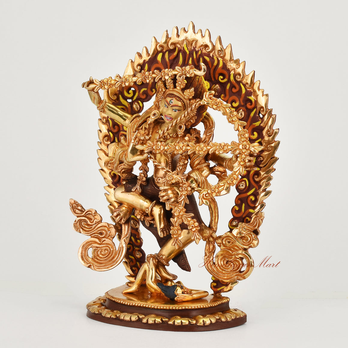 Left side view of handcrafted gold gilded face painted Kurukulla copper statue