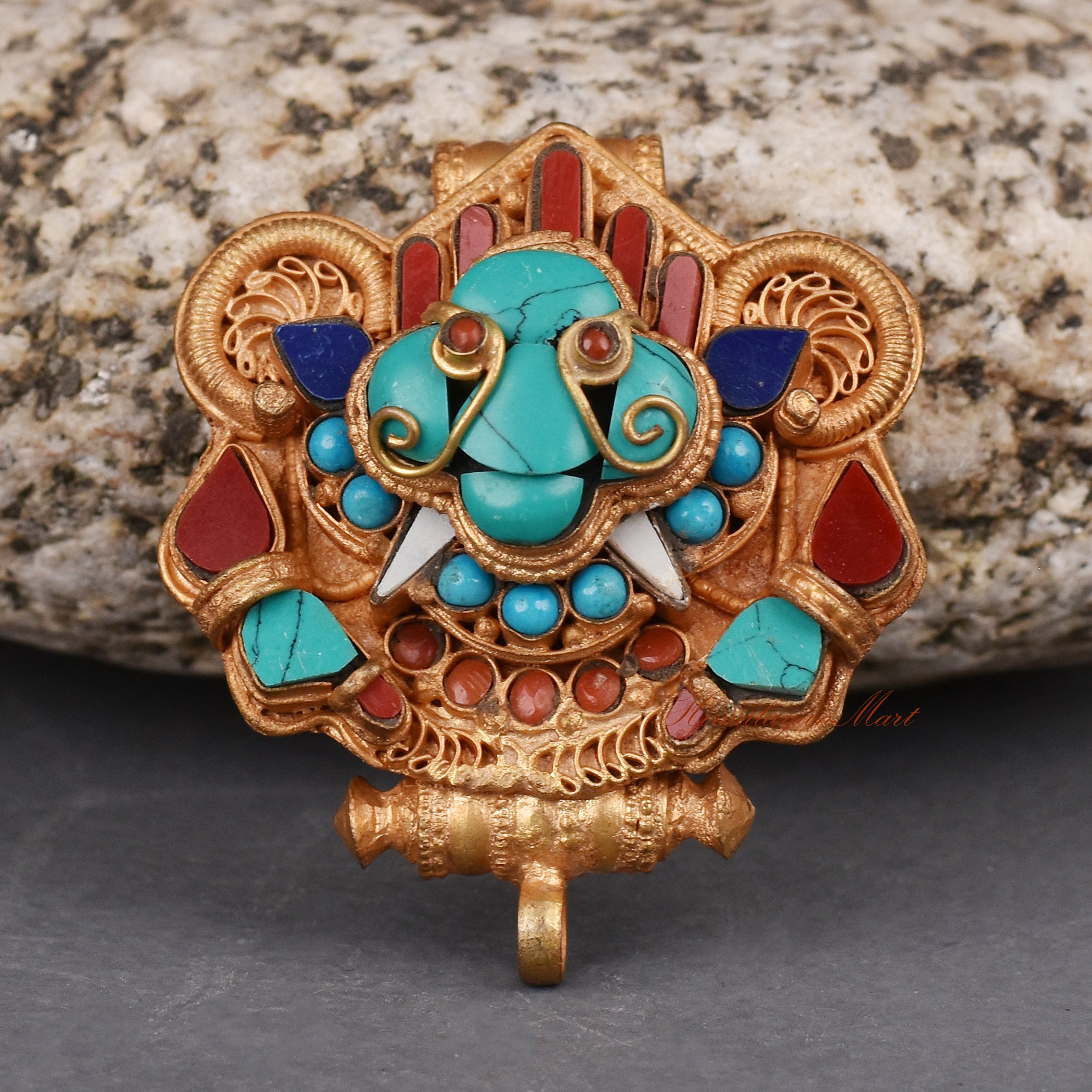 Handcrafted Cheppu Face Ghau prayer box pendant necklace with gold plating and semi-precious stones, made by Nepalese artisans.