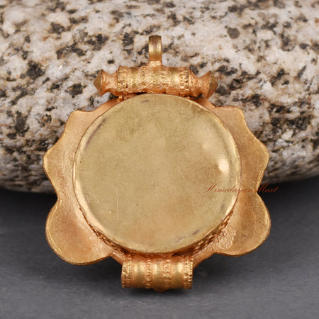Back view of handcrafted Cheppu Face Ghau pendant prayer box showcasing detailed Nepalese metalwork.