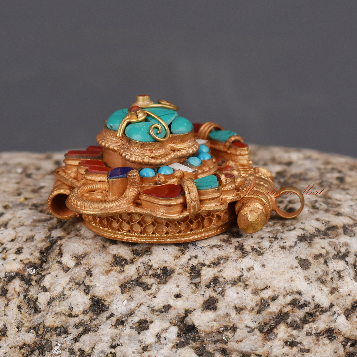 Right side view of handcrafted Cheppu Face Ghau pendant necklace with sacred Buddhist symbolism.