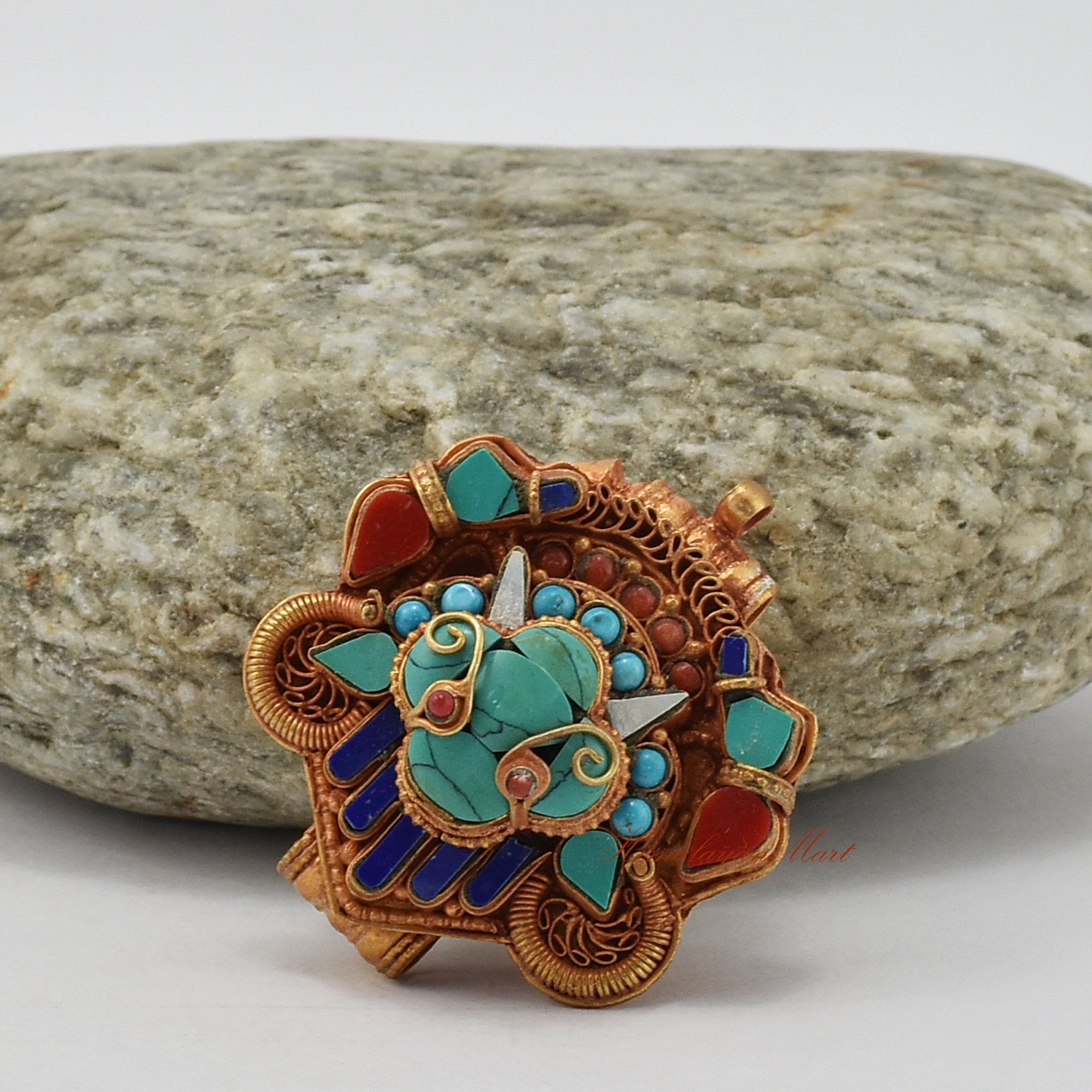 Left-side view of Chhepu Face Ghau pendant – intricate copper prayer box necklace with gold plating and semi-precious stones.