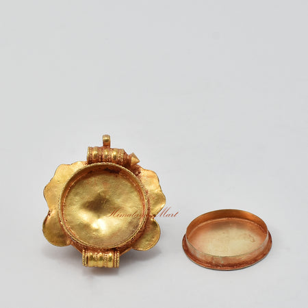 Opened view of Chhepu Face Ghau prayer box pendant, showing inner compartment for mantras, relics, or sacred items.