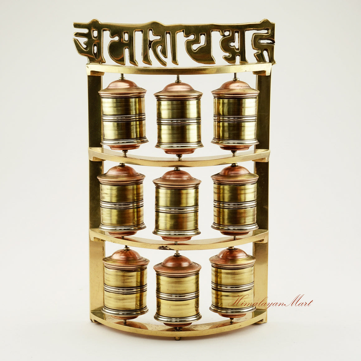 Handcrafted Tabletop Prayer Wheel with nine small Mani wheels spinning during Buddhist meditation practice