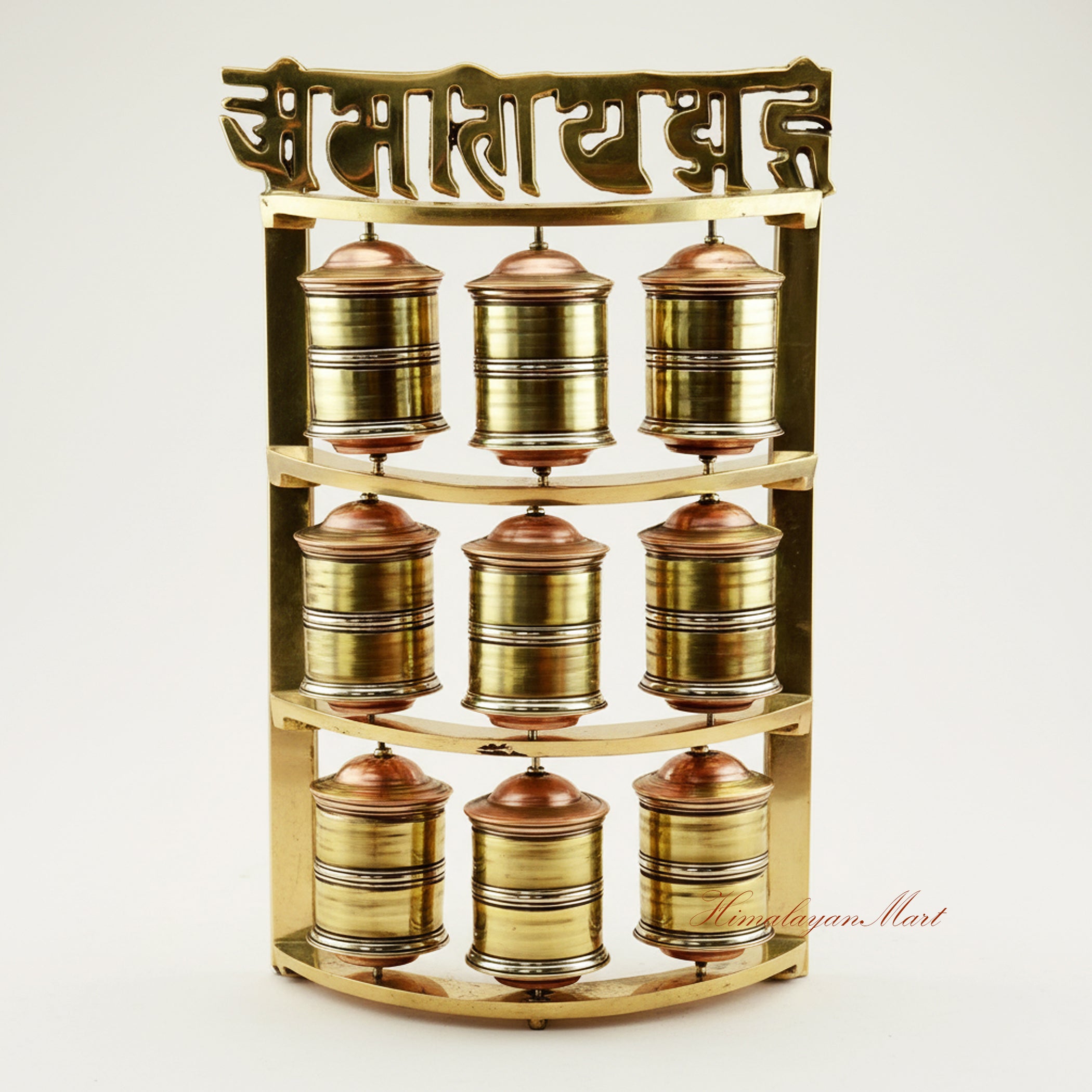 Handcrafted Tabletop Prayer Wheel with nine small Mani wheels spinning during Buddhist meditation practice