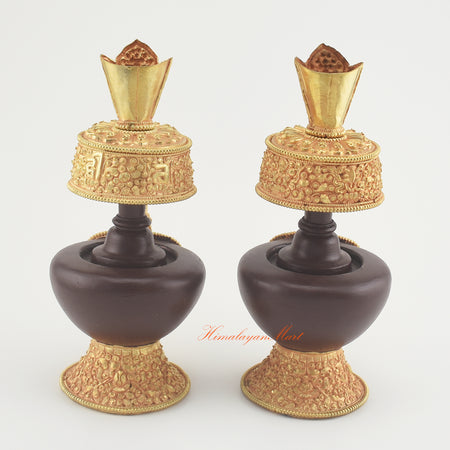 Back view of the Handcrafted Tibetan Bhumba Set showing hand-carved Buddhist symbols with oxidized copper and gold-plated details.