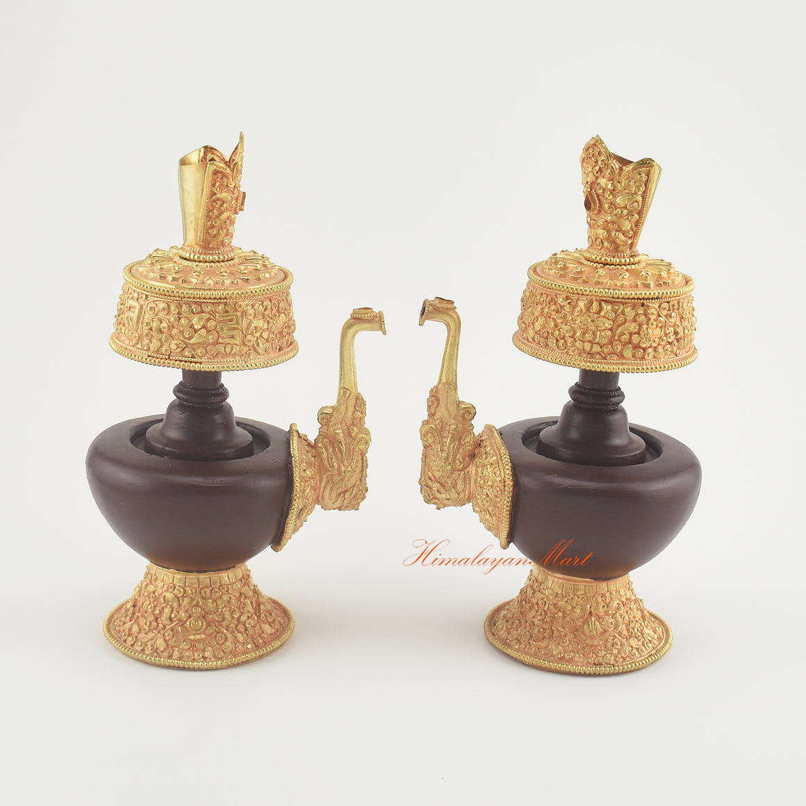 Handcrafted Tibetan Bhumba Set placed together, displaying matching Buddhist ritual offering vases with artisan metalwork.