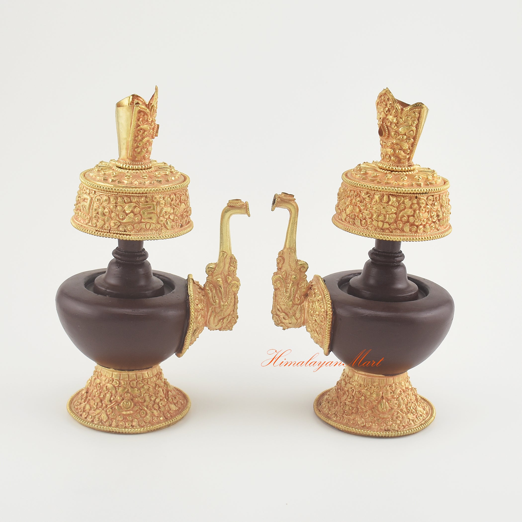 Handcrafted Tibetan Bhumba Set placed together, displaying matching Buddhist ritual offering vases with artisan metalwork.