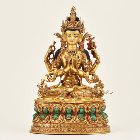 Handmade Nepalese Chenrezig statue depicting the Tibetan Bodhisattva of Compassion with serene hand-painted face and traditional gilding