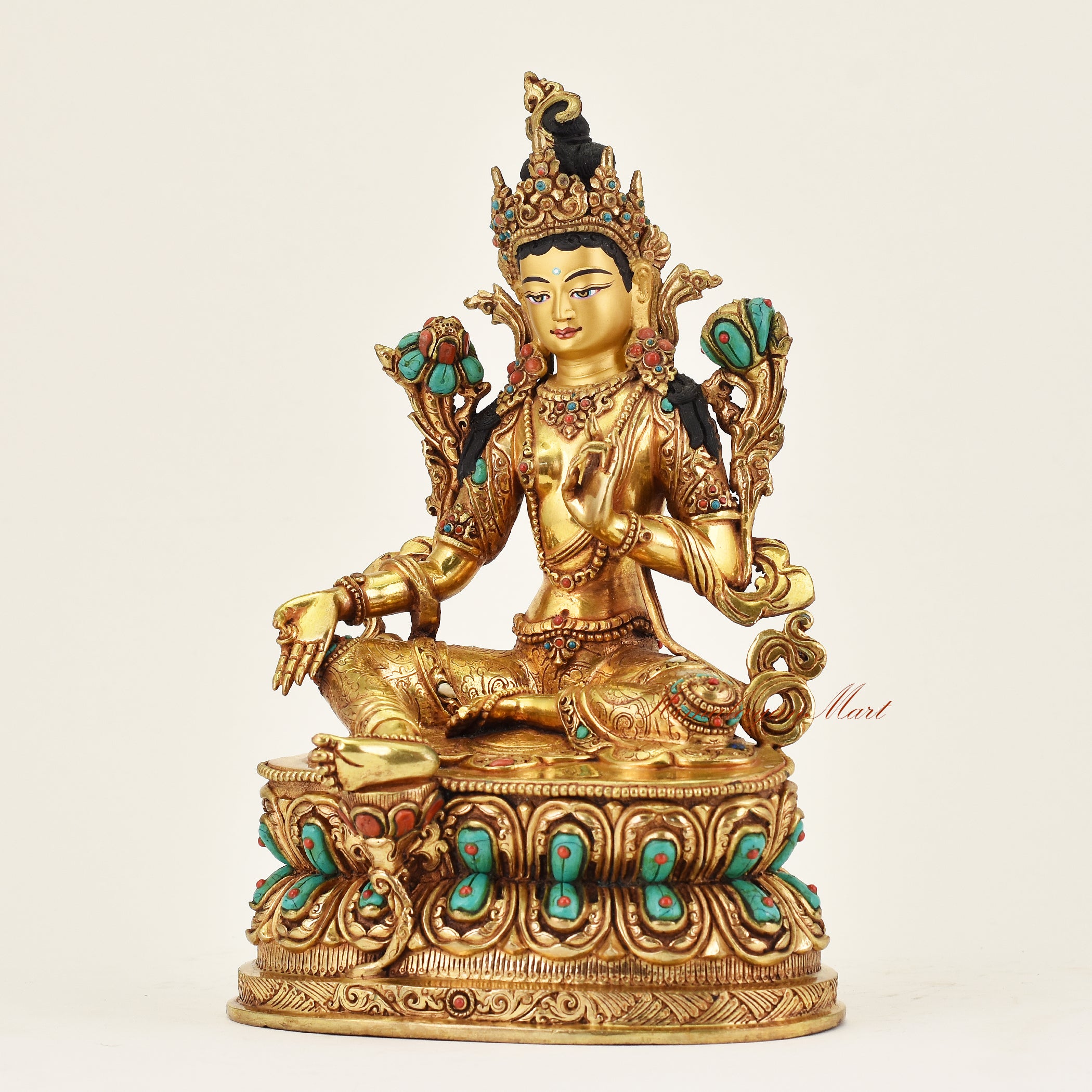 Left angle of Green Tara statue handcrafted in Nepal with peaceful expression, intricate detailing, and symbolic mudras