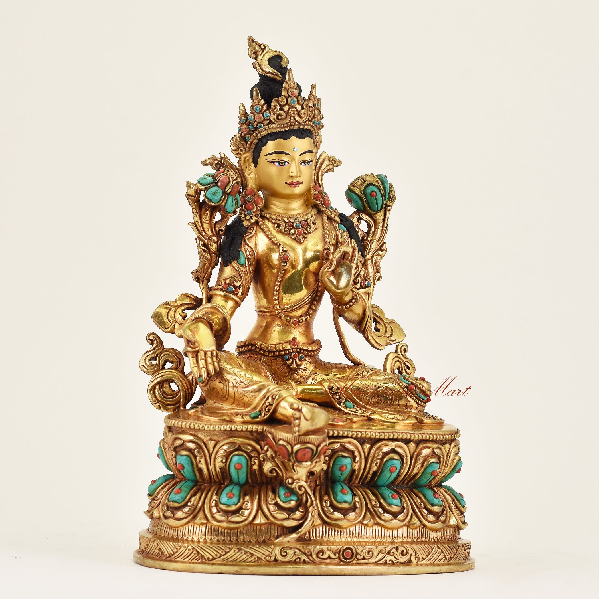 Right side view of handmade Nepalese Green Tara statue showing detailed robes, sacred ornaments, and traditional Nepalese craftsmanship