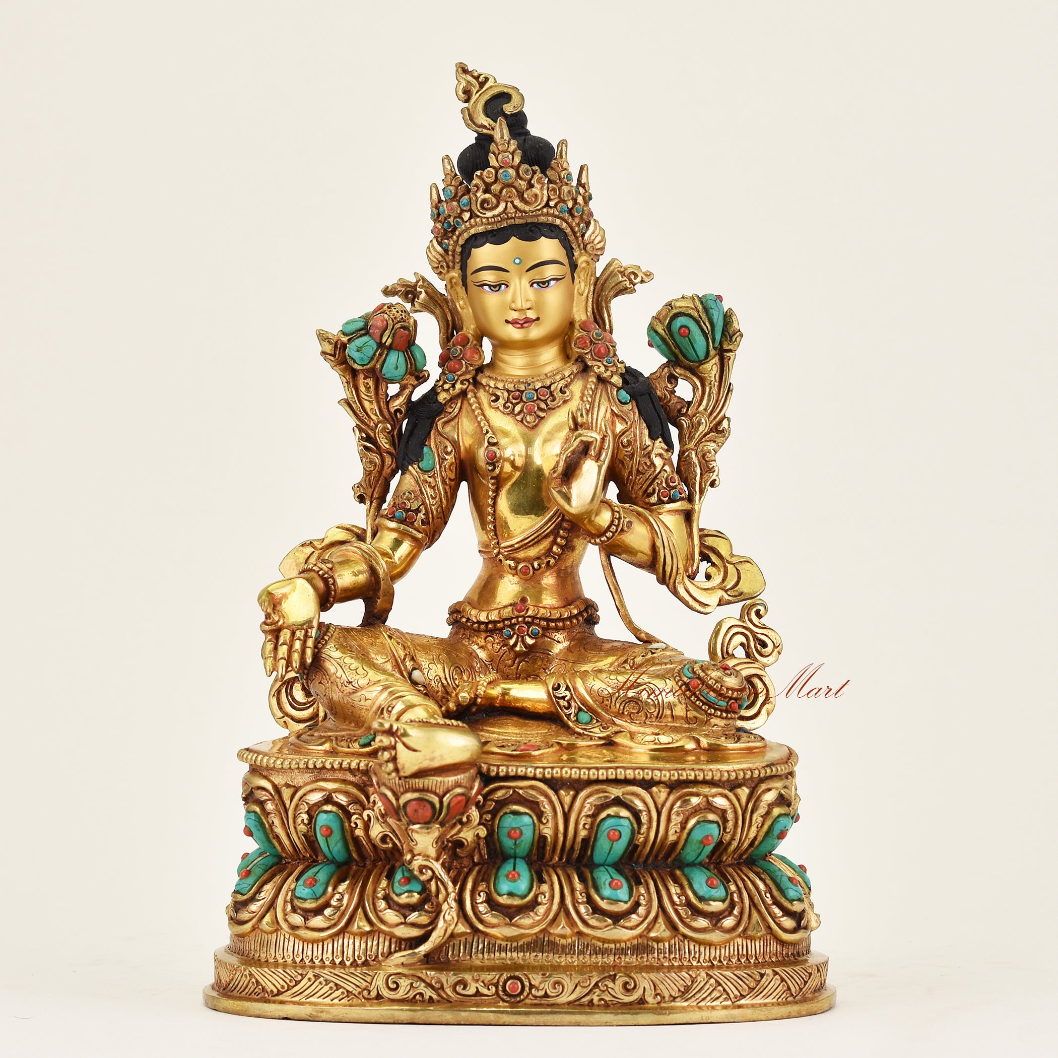 Handmade Nepalese Green Tara statue representing the Goddess of Compassion and Swift Protection with gilded accents and serene hand-painted face