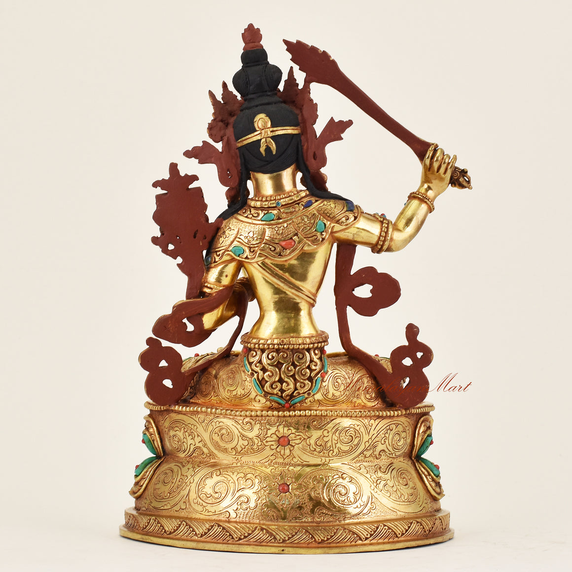 Back view of handmade Nepalese Manjushri statue displaying traditional hand-finished details and spiritual iconography