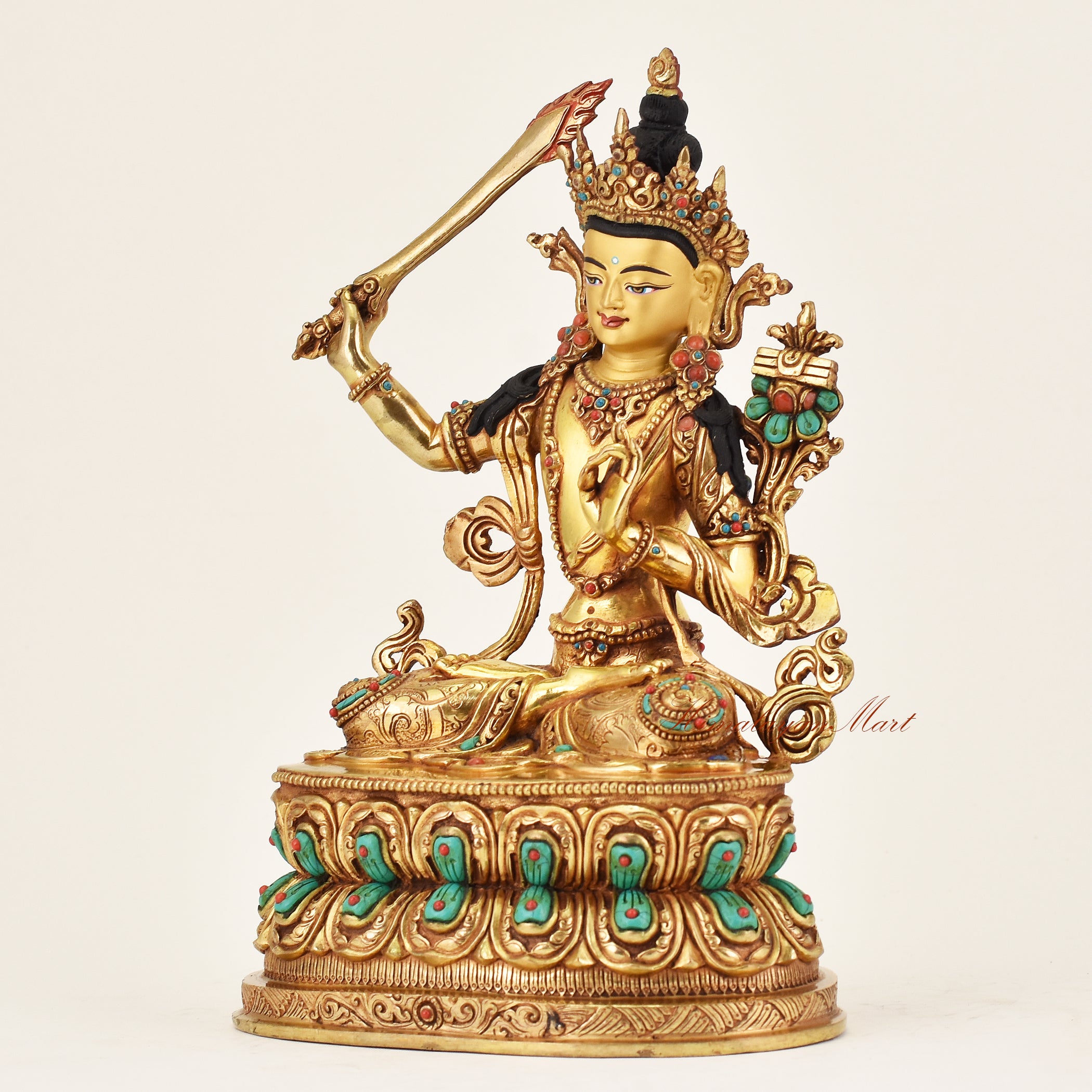 Left angle of handmade Nepalese Manjushri Buddha statue with lotus seat and sacred attributes representing enlightened wisdom