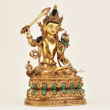 Right side view of handmade Nepalese Manjushri statue showing detailed robes and sword symbolizing wisdom and enlightenment