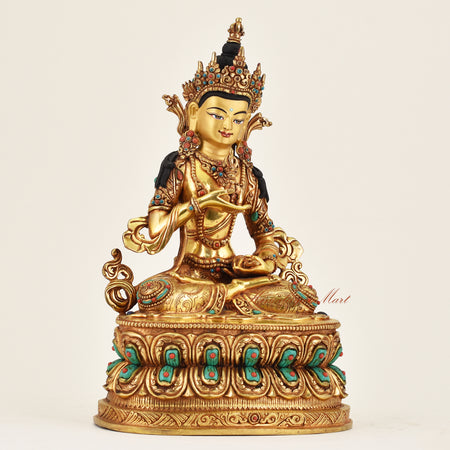 Right side view of handmade Nepalese Vajrasattva statue showing detailed robes and vajra bell representing purification and compassion