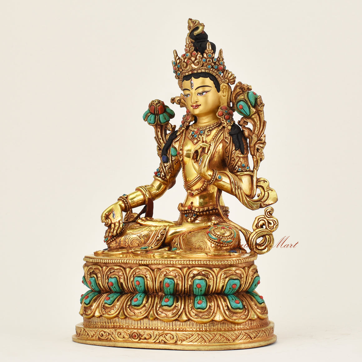 Left angle of handmade Nepalese White Tara Buddha statue with serene expression and sacred iconography of longevity and healing