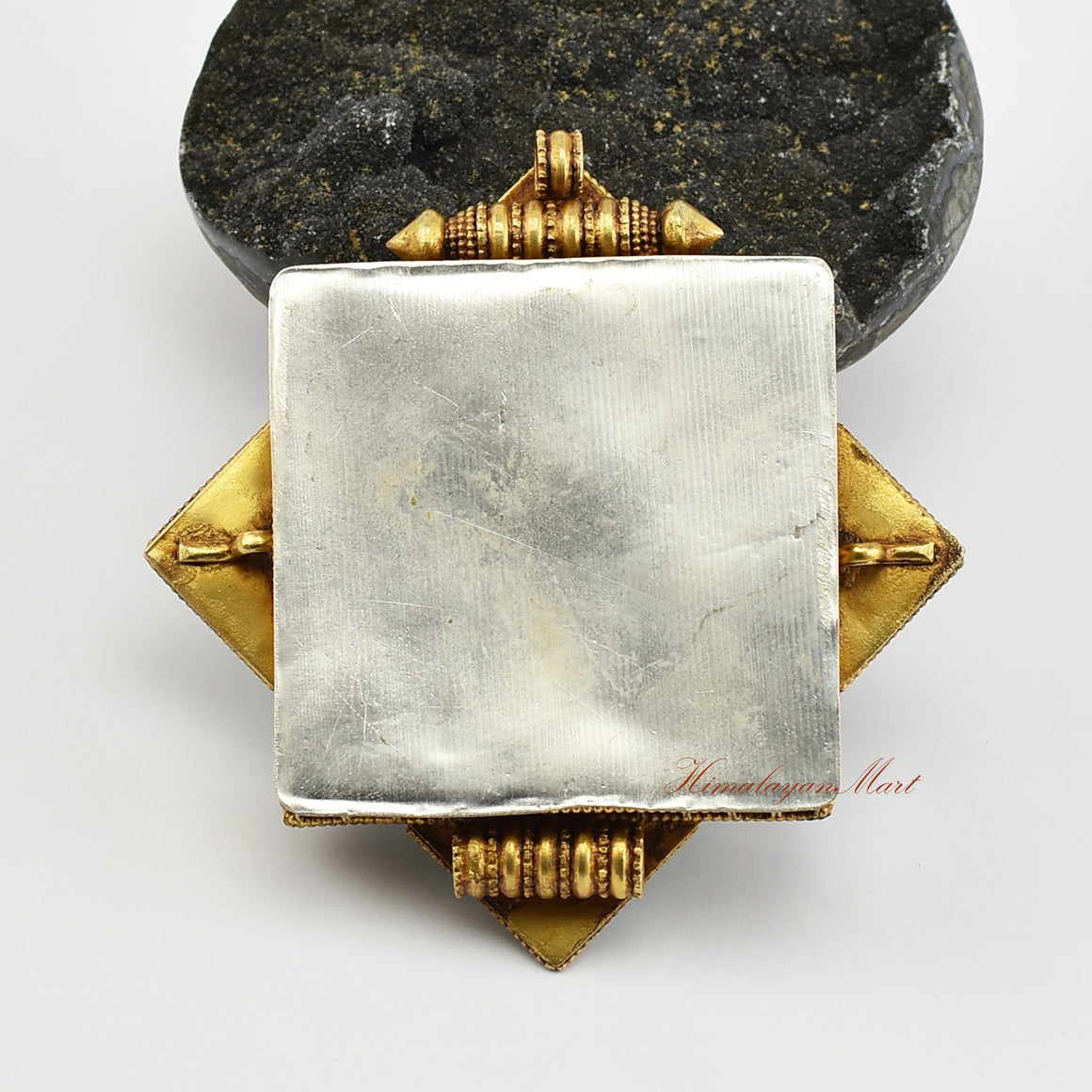 Back view of Handmade Religious Prayer Box Pendant showcasing detailed carvings and traditional Buddhist craftsmanship.