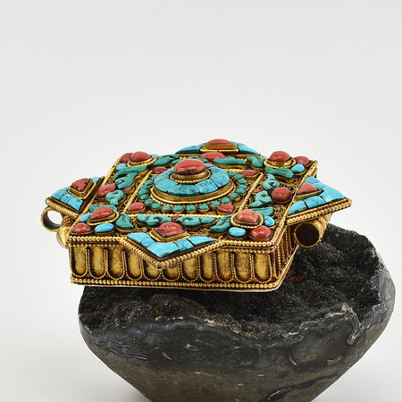 Left view of Handmade Religious Prayer Box Pendant highlighting intricate filigree work and gemstone inlays.