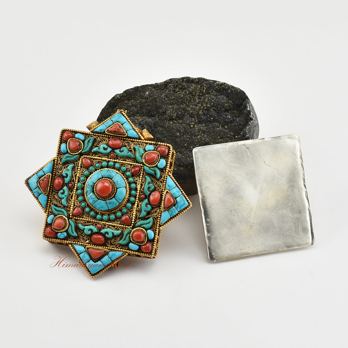 Handmade Religious Prayer Box Pendant opened to reveal its inner chamber for sacred mantras or spiritual relics.