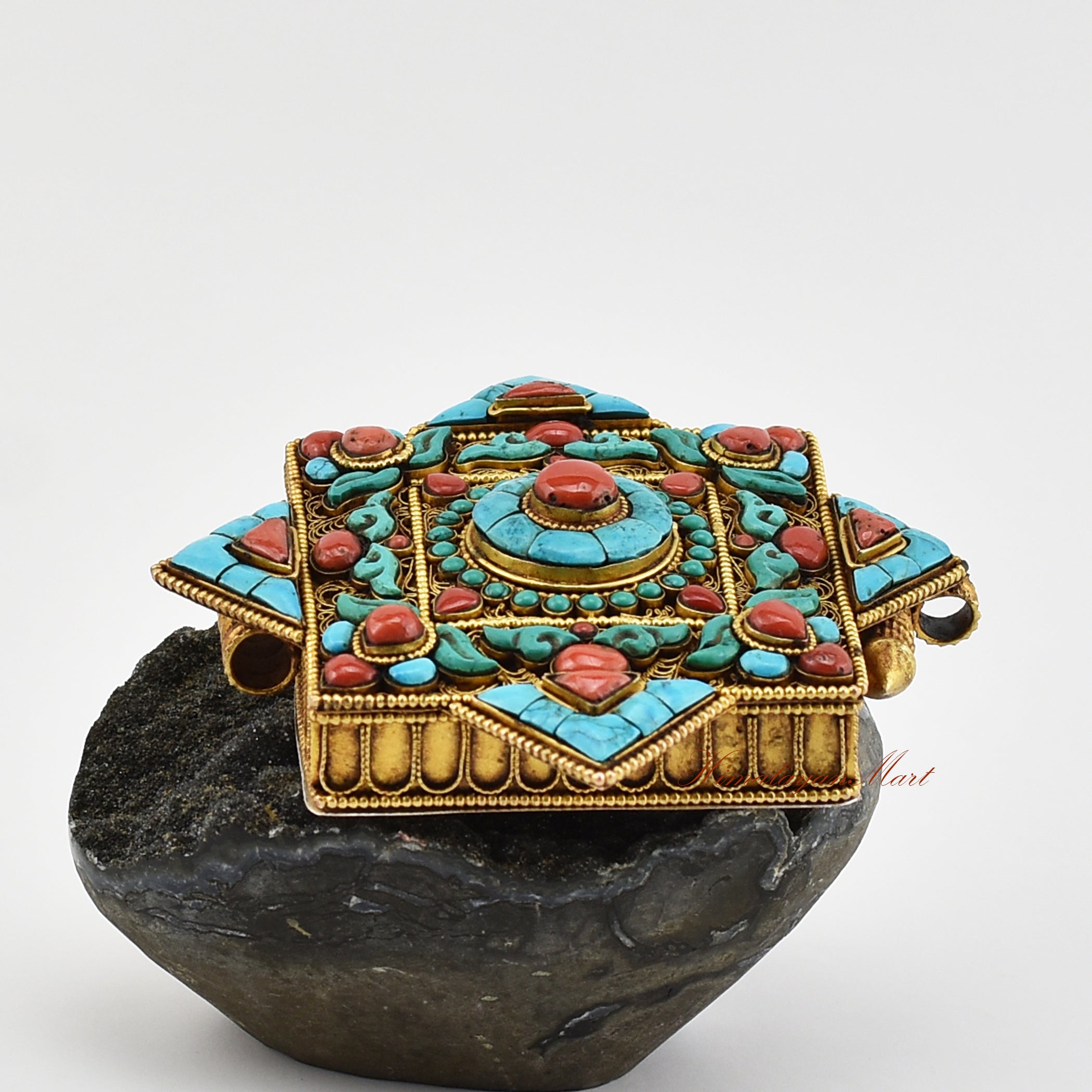 Right view of Handmade Religious Prayer Box Pendant featuring coral centerpiece and floral filigree patterns.