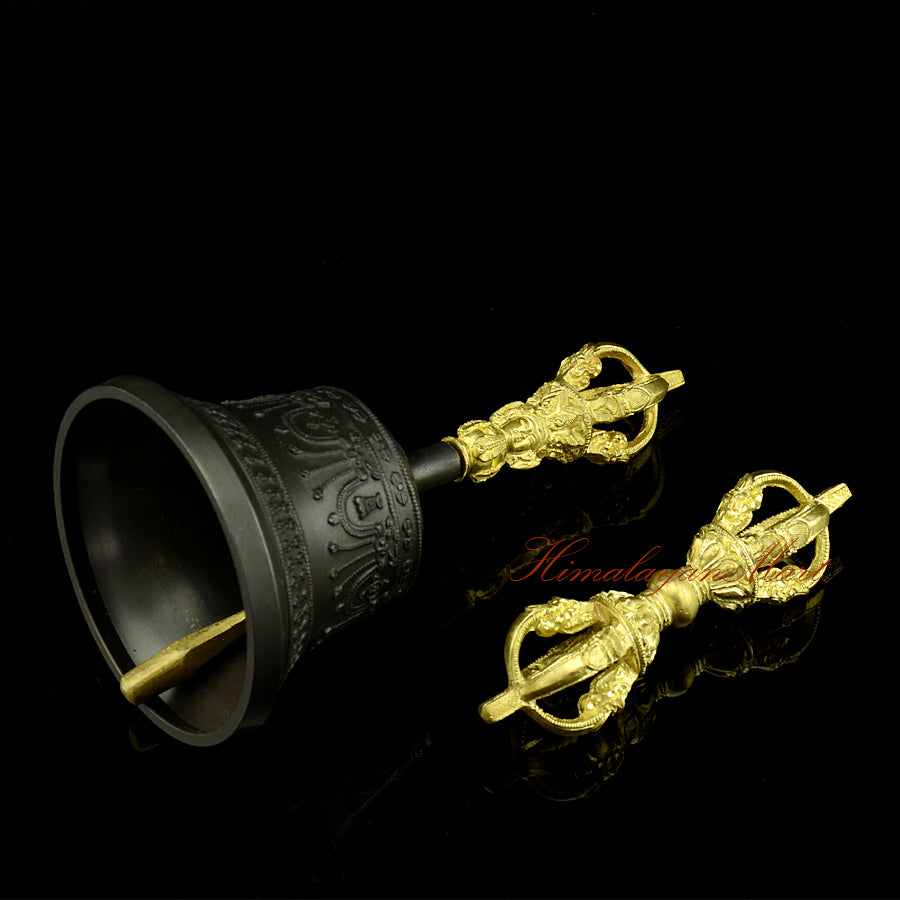 Himalayan Vajra Bell Set with black patina bell and gold plated vajra, handmade Buddhist ritual instrument, left side view showing engraved detail